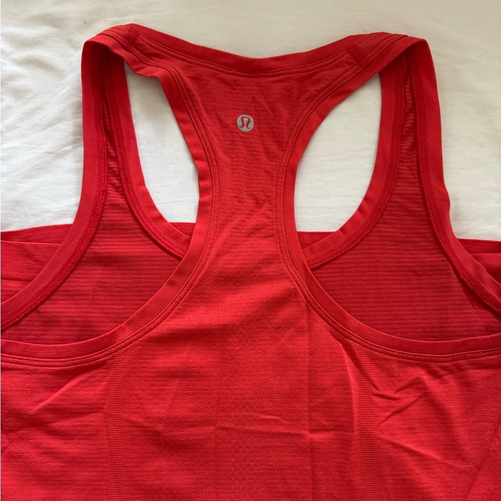 Lululemon red/orange racer back tank top.